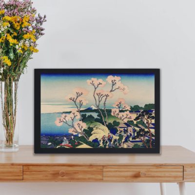 Infidu Goten-Yama Hill, Shinagawa on the Tokaido by Katsushika Hokusai (1760-1849) a traditional Japanese Ukyio-e style illustration of sakura blossom with Mount Fuji in the background and village people having a picnic and enjoying life in high resolution Vintage Art