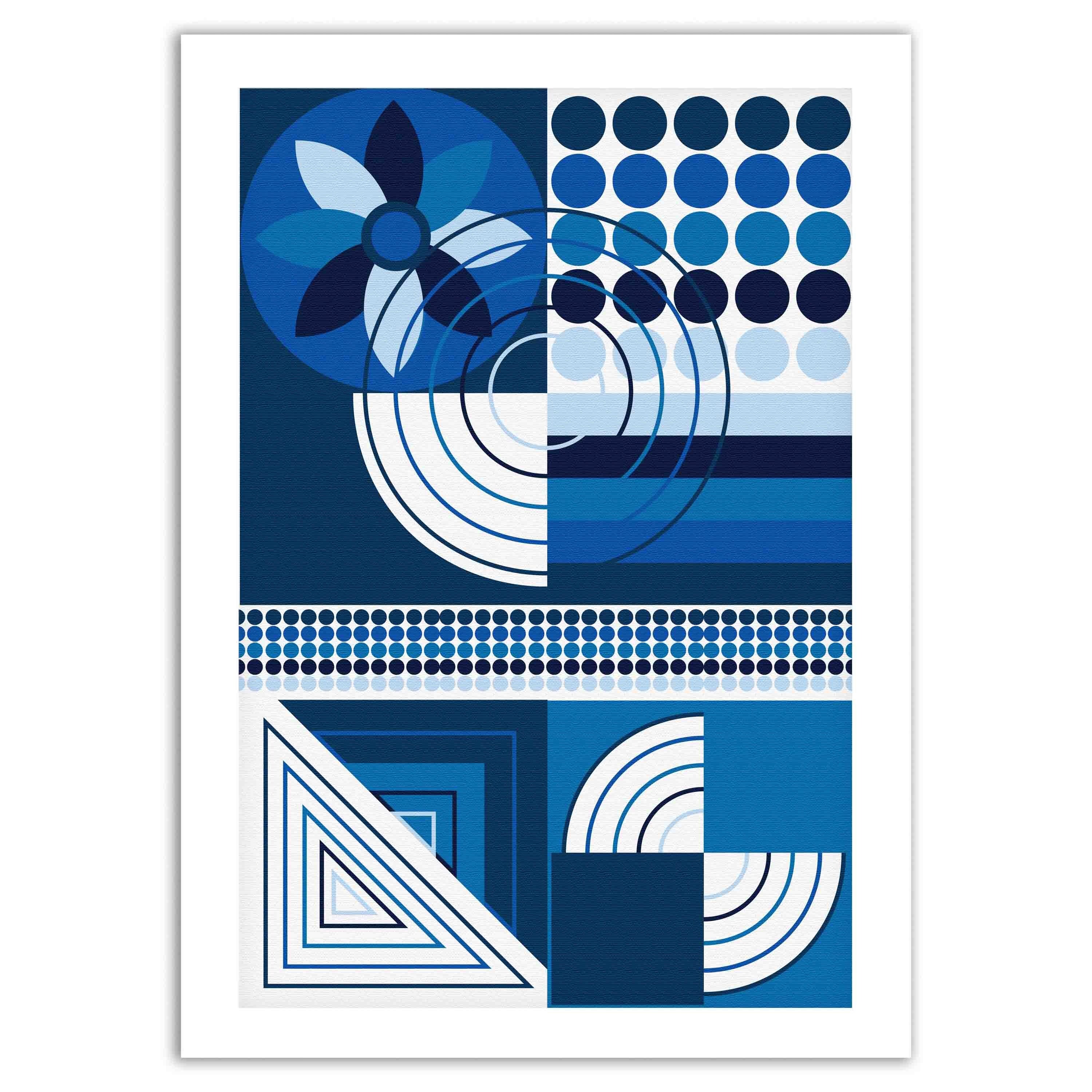 Abstract wall art with geometric shapes in blue, white, and black, framed in black, displayed on a light gray wall in a cozy setting.