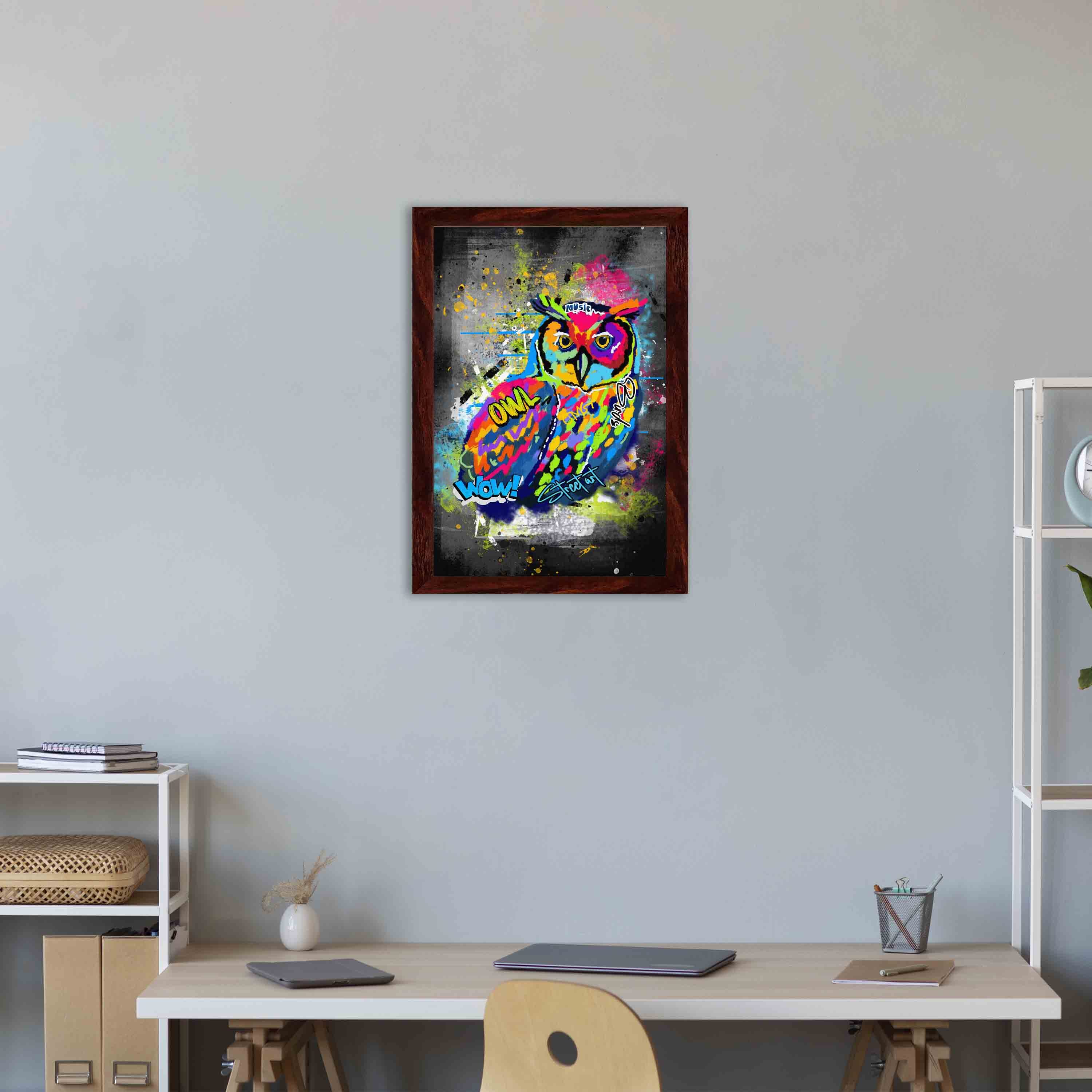 Graffiti-style wall art featuring a colorful owl with bright shades of blue, yellow, red, pink, and green on a dark, edgy background.