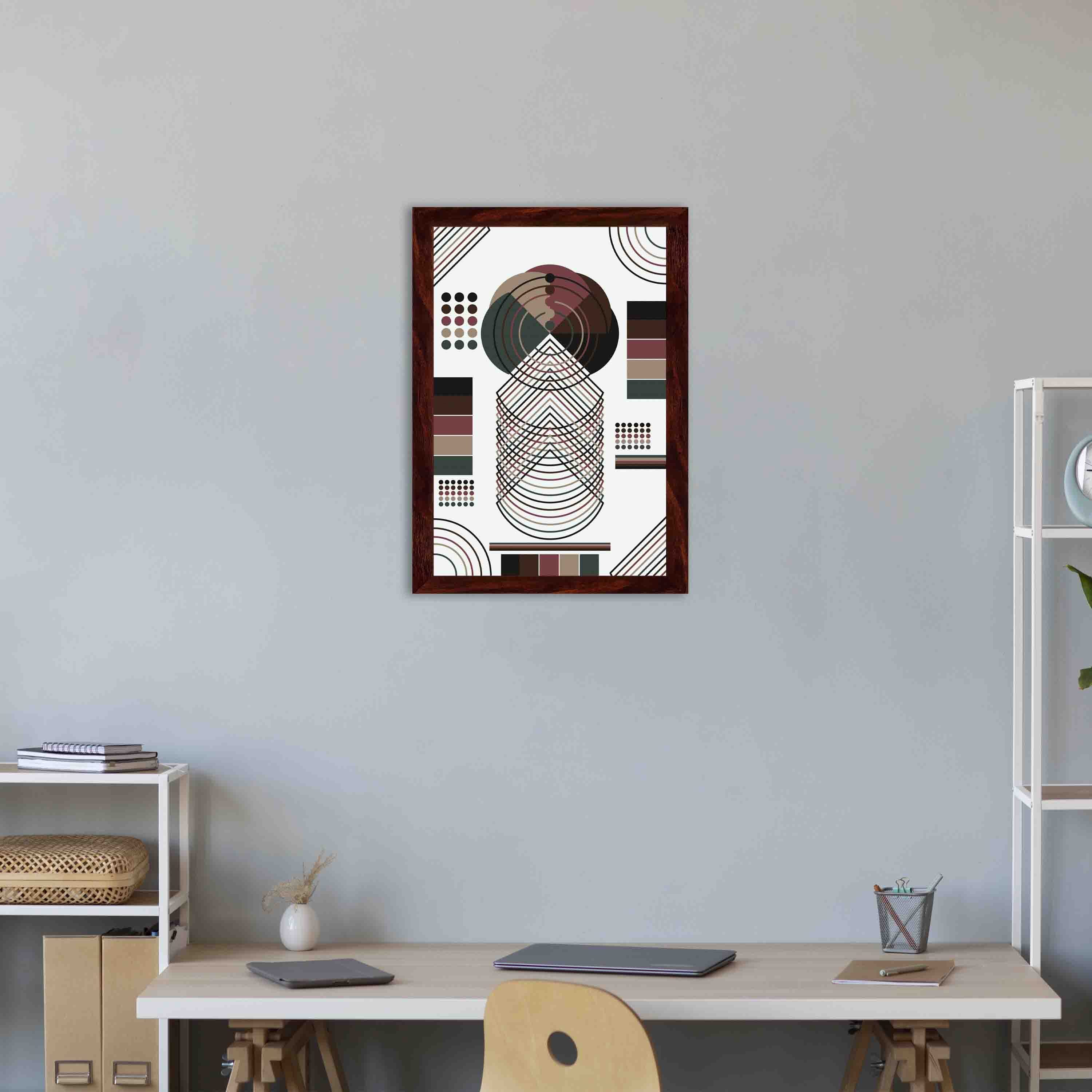 Abstract wall art with geometric shapes in brown, black, beige, and dark green, framed in brown, displayed on a white background.