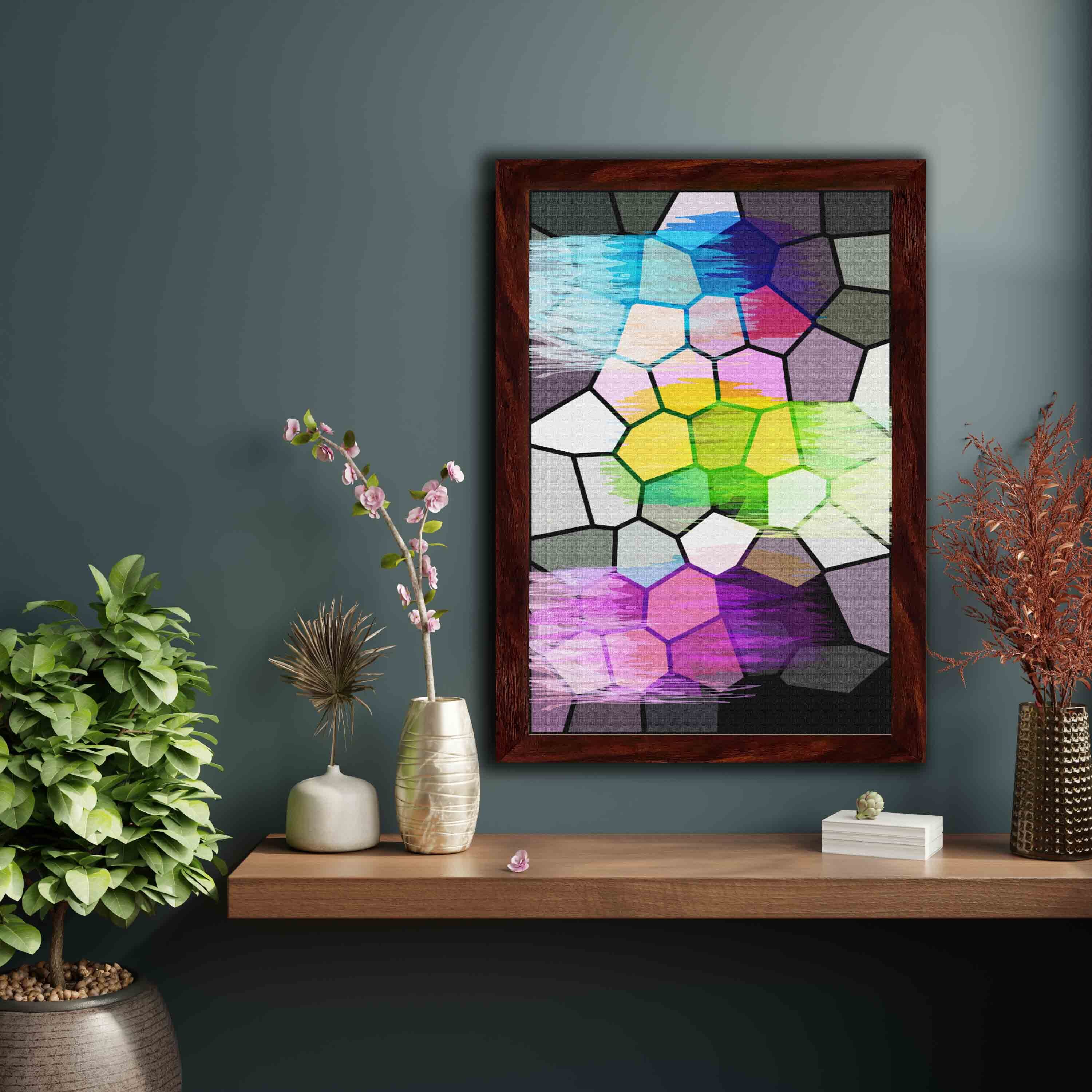 Abstract wall art with a stained glass-style mosaic design in shades of blue, purple, green, pink, yellow, and gray, framed in black.
