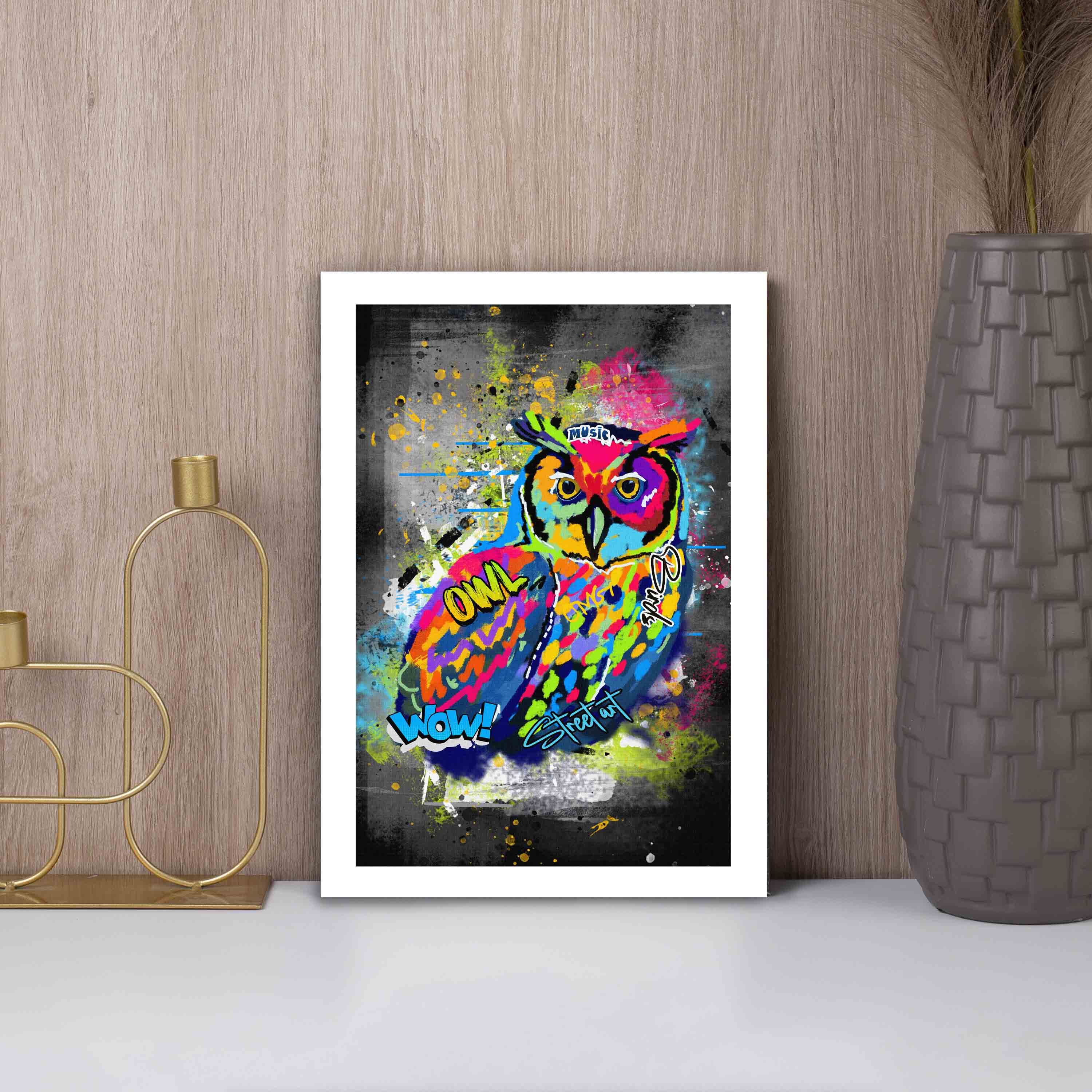 Graffiti-style wall art featuring a colorful owl with bright shades of blue, yellow, red, pink, and green on a dark, edgy background.
