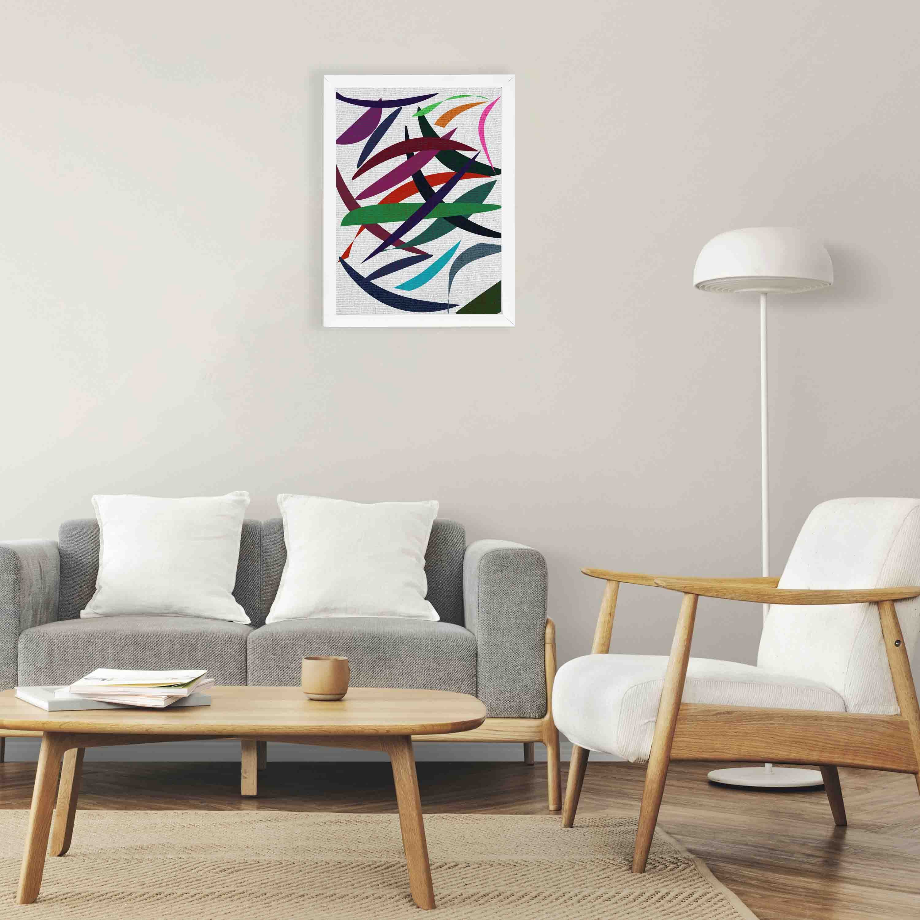 Abstract wall art with overlapping red, green, blue, purple, and pink shapes on a textured white background, framed in white wood.