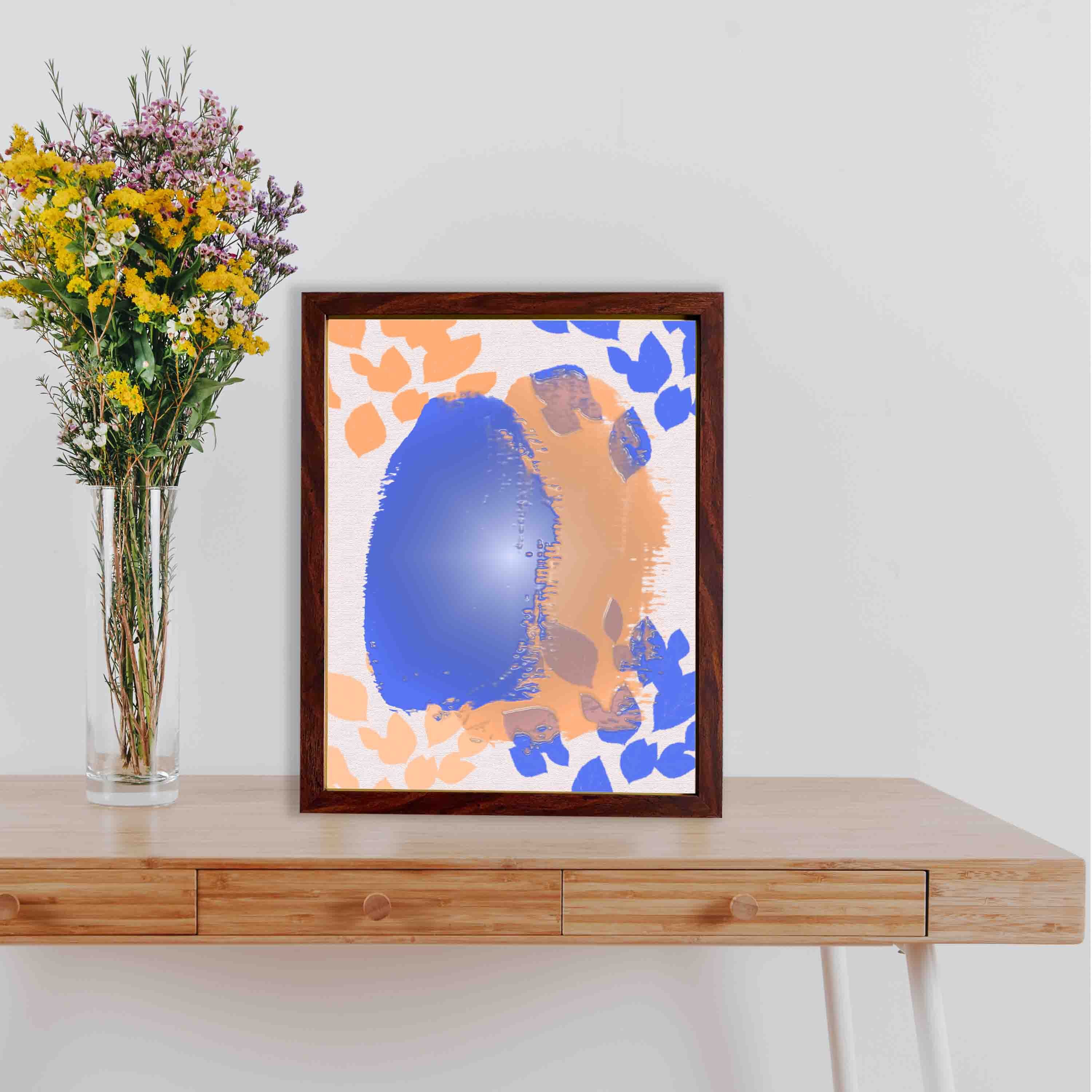 Abstract wall art with a large blue shape and orange brushstroke-like patterns on a white background, creating a bold and modern look.