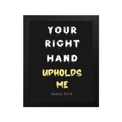 Infidu Your Right Hand Upholds Me Psalm 63:8 Bible Wall Art with a black background, yellow, and white font, and black frame hung on the wall
