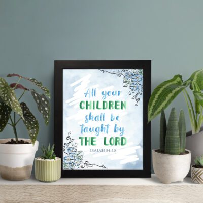 Isaiah 54:13 Christian wall art with blue sky background and leaf designs, featuring the verse All your CHILDREN shall be taught by THE LORD. Wall Art displayed on the table in a black frame