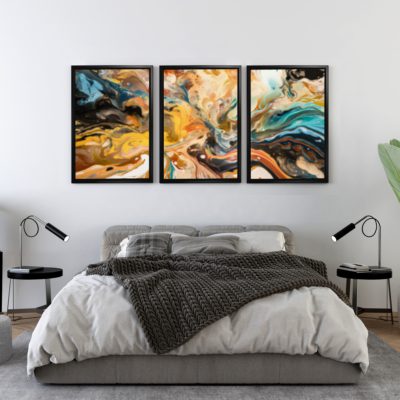 Abstract wall art with yellow, blue, black, and brown colors blending smoothly, framed in black, displayed on a white wall. hung on the wall