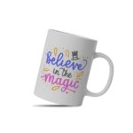 White coffee mug with Believe in the Magic in blue, black, and pink, decorated with a magician's hat and colorful elements. A microwave-friendly espresso cup.