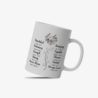 White coffee mug with "I Am" and Bible verses in black text, arranged in two columns with a floral element. A microwave-friendly espresso cup for faith and inspiration.