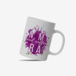 White coffee mug with "In My Iced Coffee Era" in stylish white text over a purple paint splash. A microwave-friendly espresso cup with a trendy design.