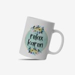 White coffee mug with "Relax Karen" in black casual font inside a light blue-green watercolor circle, decorated with small flowers. A microwave-friendly espresso cup.