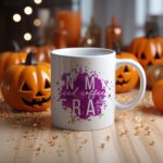 White coffee mug with "In My Iced Coffee Era" in stylish white text over a purple paint splash. A microwave-friendly espresso cup with a trendy design.