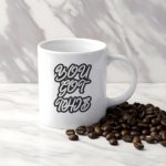 White coffee mug with "YOU GOT THIS" in bold, black cursive font. A microwave-friendly espresso cup perfect for motivation and encouragement.