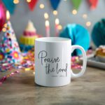 White coffee mug with "Praise the Lord" in elegant cursive and "Psalm 150:1" below. A microwave-friendly espresso cup for faith and inspiration.