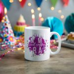 White coffee mug with "In My Iced Coffee Era" in stylish white text over a purple paint splash. A microwave-friendly espresso cup with a trendy design.