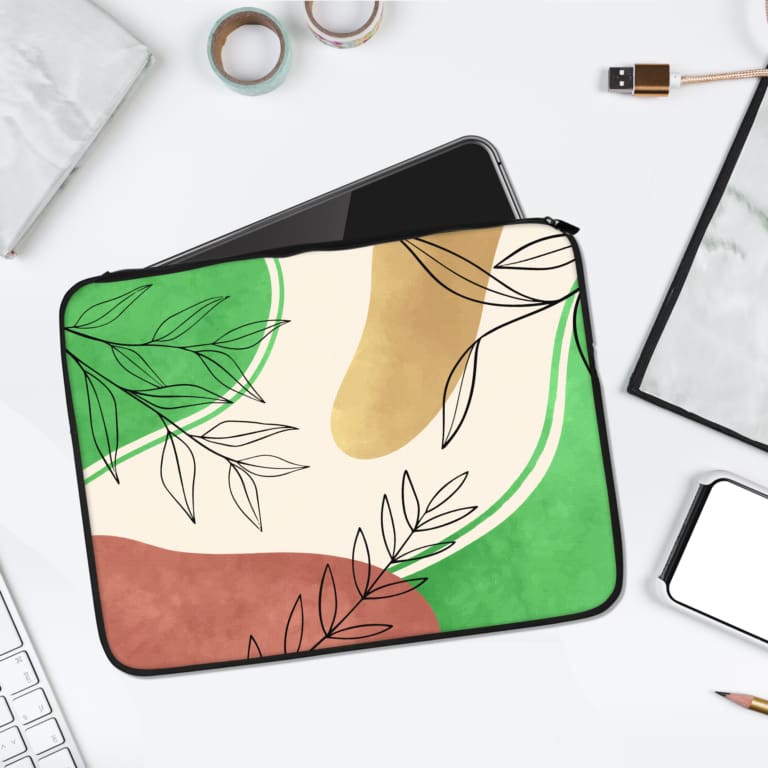 Infidu Modern Abstract Laptop Sleeve with overlapping shapes and simple black line-drawn leaves in green, pink, beige, and white. laptop sleeve kept on a plain white background