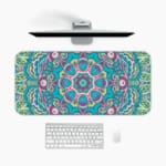 Infidu Colorful Teal and Pink Mandala Design Desk Pad with intricate teal, pink, and white patterns. A desk pad under the computer
