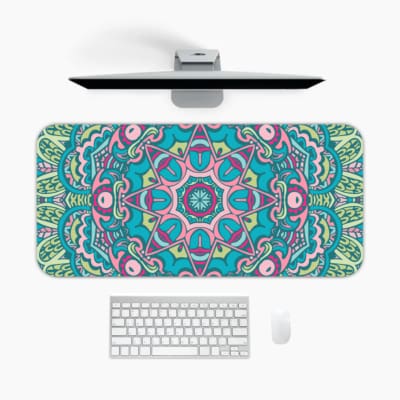Infidu Colorful Teal and Pink Mandala Design Desk Pad with intricate teal, pink, and white patterns. A desk pad under the computer
