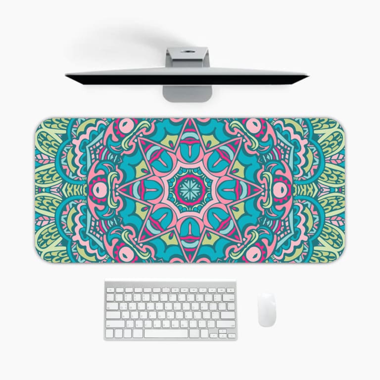 Infidu Colorful Teal and Pink Mandala Design Desk Pad with intricate teal, pink, and white patterns. A desk pad under the computer