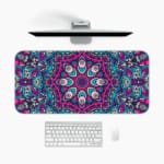 Infidu Colorful Mandala Design Desk Pad with intricate patterns in pink, blue, purple, and teal, plus white and black accents. A desk pad under the computer