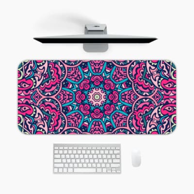Infidu Colorful Mandala Desk Pad featuring a vivid mandala pattern with symmetrical shapes in pink, purple, and blue tones. A desk pad under the computer