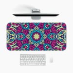 Infidu Colorful Mandala Design Desk Pad with intricate blue, pink, and purple patterns on a light background. A desk pad under the computer