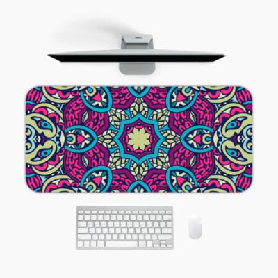 Infidu Colorful Mandala Design Desk Pad with intricate blue, pink, and purple patterns on a light background. A desk pad under the computer