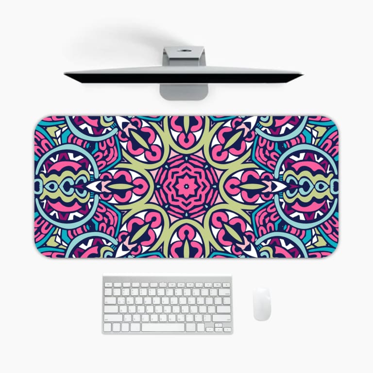 Infidu Colorful Geometric Pattern Desk Pad with pink, blue, yellow, and black geometric shapes on a soft yellow background. A desk pad under the computer
