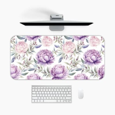 Infidu Purple Floral Design Desk Pad with large purple flowers and soft green leaves on a light, neutral background. A desk pad under the computer