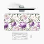 Infidu desk pad with purple and white flowers and green leaves on a white background. A desk pad under the computer