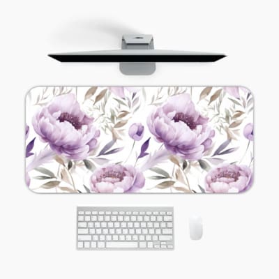 Infidu Soft Floral Desk Pad with white background, large purple and lavender flowers, and light gray and blue leaves. A desk pad under the computer