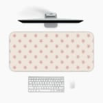 Light pink desk pad with small star design, perfect for adding charm to your workspace. A desk pad under the computer
