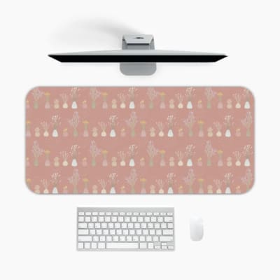 Infidu Beige Desk Mat with a subtle pattern of small shapes or icons on a soft beige background. A desk pad under the computer