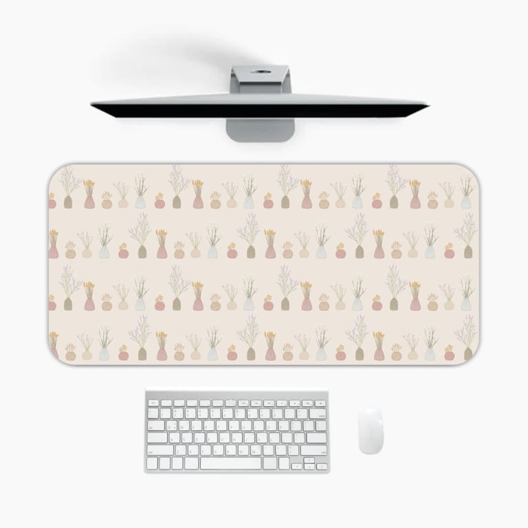 Infidu Chess Piece Design Desk Mat featuring chess pieces in soft pastel colors with a light background. A desk pad under the computer
