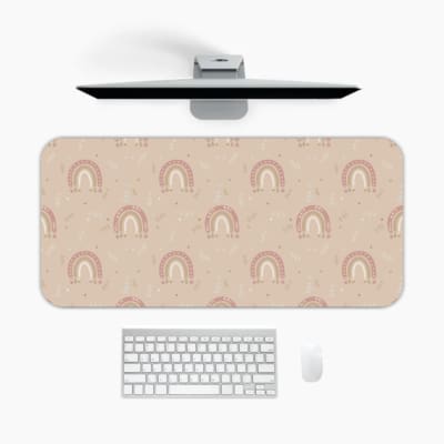 Infidu Light Brown Desk Pad with Red and White Rainbow design featuring soft pastel tones and a repeating rainbow pattern. A desk pad under the computer