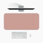 Infidu Light Pink Desk Pad with a plain, soft pink design A desk pad under the computer
