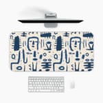 Blue tribal symbols desk pad with abstract patterns on a dim white background. A desk pad under the computer