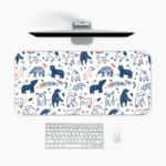 Infidu Blue and White Animal Shapes Playful Design Desk Pad with abstract shapes on a light background. A desk pad under the computer