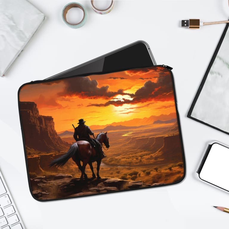Sunset cowboy horse desert design laptop sleeve with vibrant orange, yellow, and red tones. laptop sleeve kept on a plain white background
