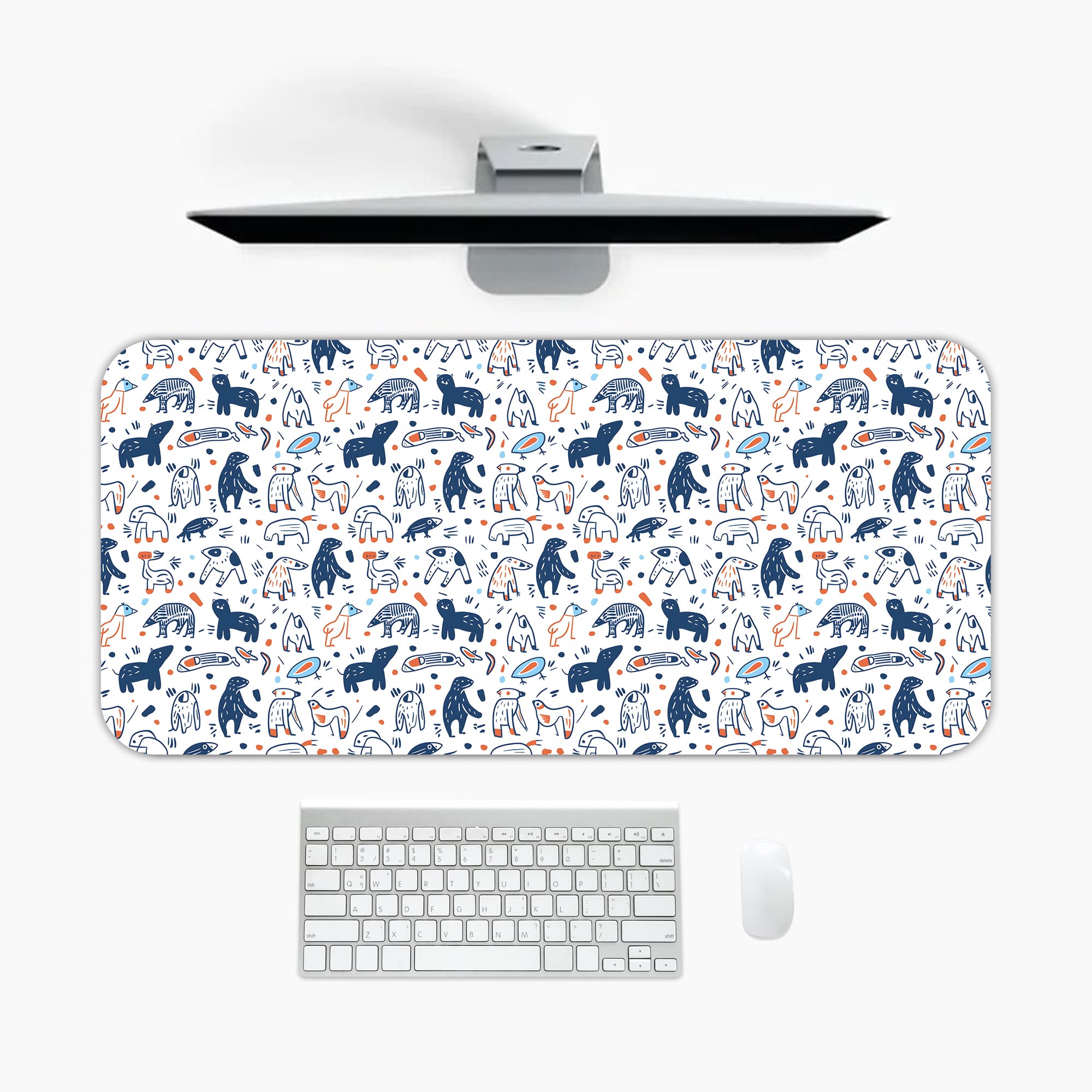 Desk pad with playful blue and dark blue bear patterns on a white background. A desk pad under the computer