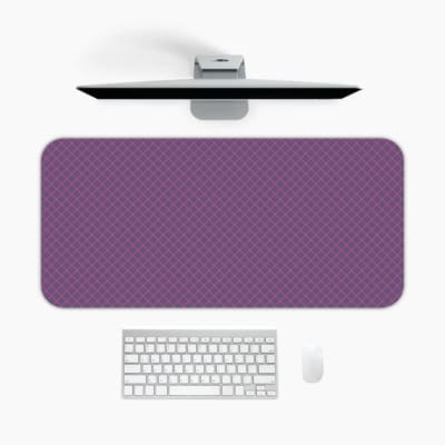 Desk pad with a purple textured background and black diamond design. A desk pad under the computer