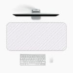 Desk pad with a white background and light gray diagonal stripes. A desk pad under the computer