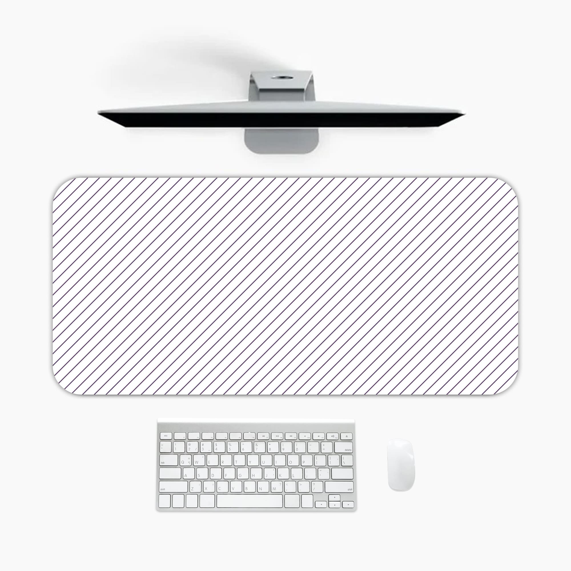 Desk pad with a white background and light gray diagonal stripes. A desk pad under the computer