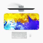 Infidu Abstract Desk Pad with yellow, blue, and green colors in flowing patterns on a vibrant background. A desk pad under the computer