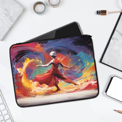Laptop sleeve with a vibrant dancer design, featuring a red dress and swirling colorful strokes in shades of blue, yellow, orange, and pink. laptop sleeve kept on a plain white background