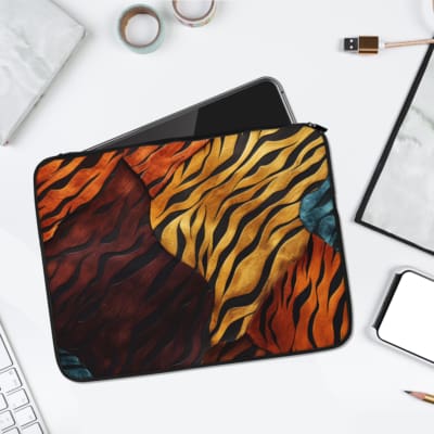 Tiger stripe-inspired vibrant laptop sleeve with abstract orange-red patterns for a bold and artistic design. laptop sleeve kept on a plain white background