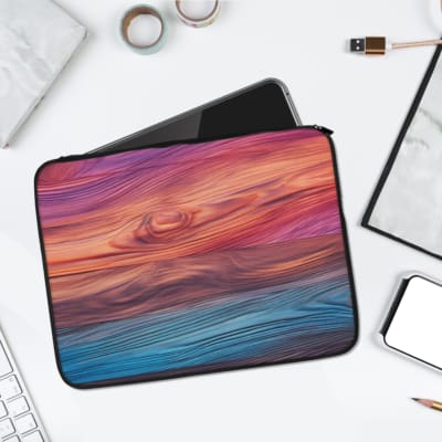Gradient wave design laptop sleeve with soft pink, purple, and blue tones, secure zip closure, and a sleek, protective build. laptop sleeve kept on a plain white background