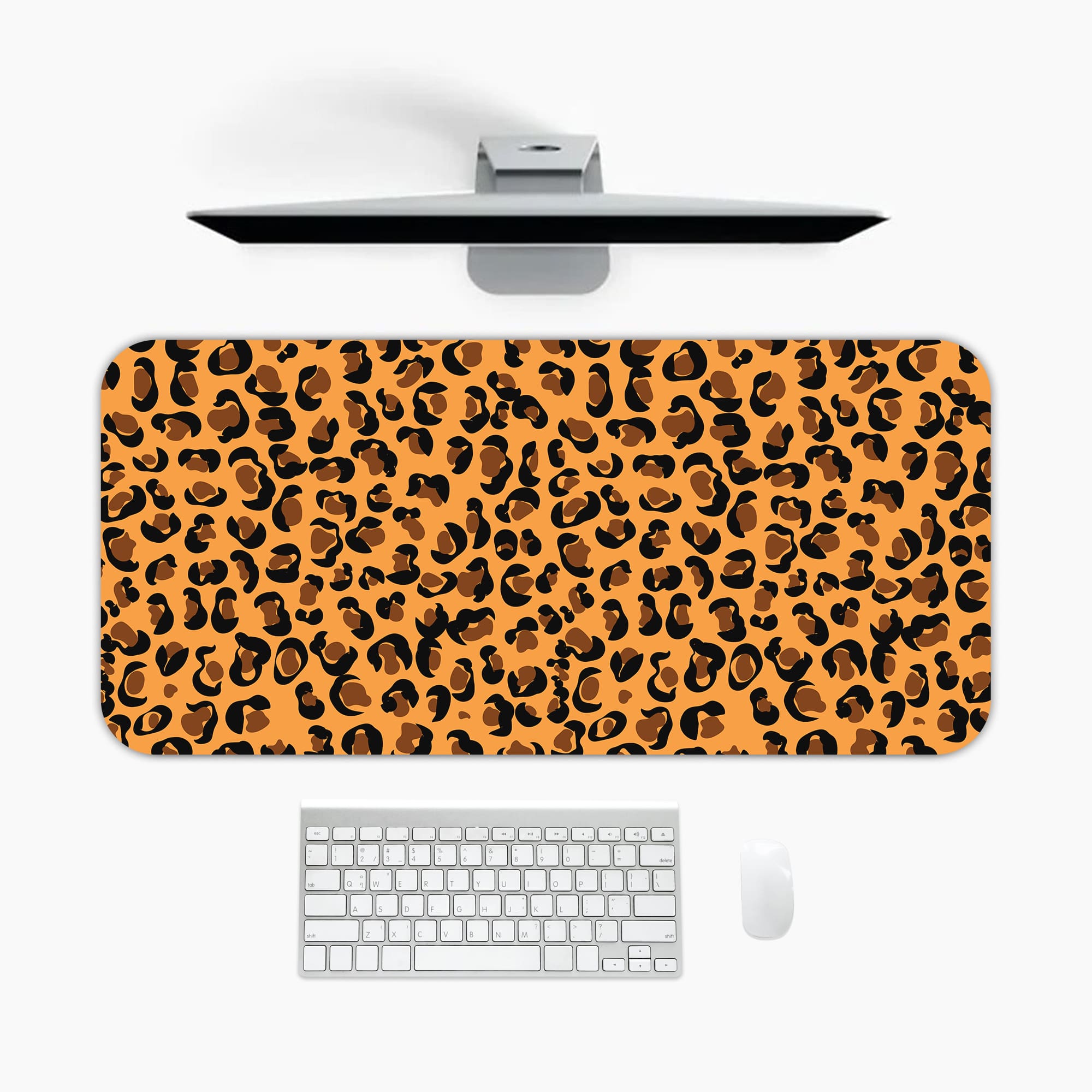 Infidu Leopard Print Design Desk Pad with black spots on a yellow background, simulating a leopard's natural fur. A desk pad under the computer