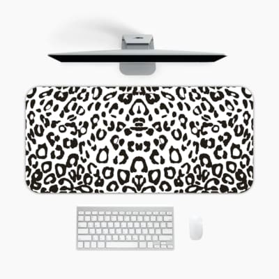 Infidu White Leopard Print Desk Pad features black spots on a white background, creating a classic and stylish leopard print design A desk pad under the computer