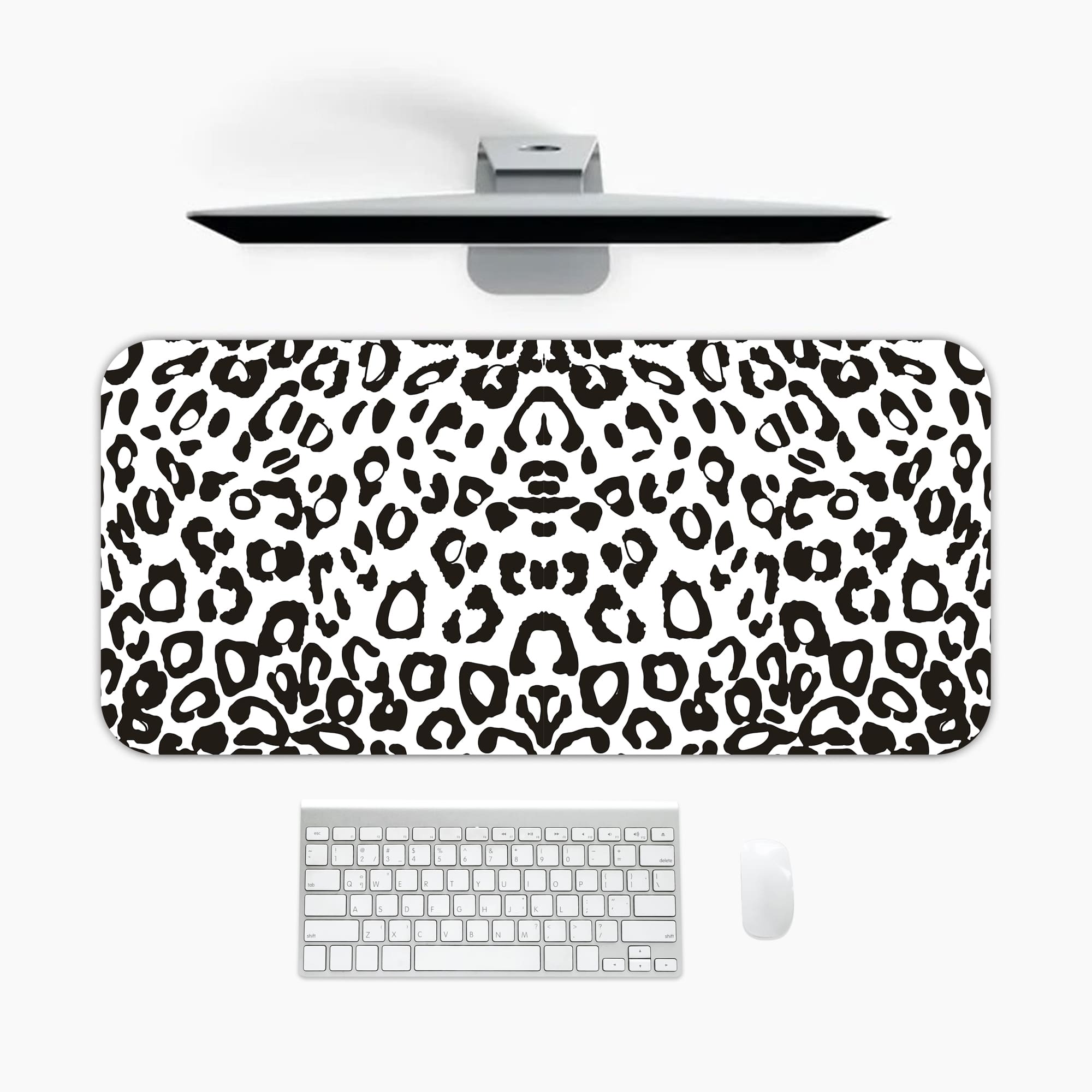 Infidu White Leopard Print Desk Pad features black spots on a white background, creating a classic and stylish leopard print design A desk pad under the computer